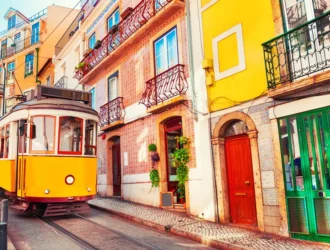 Tram and colorful houses in Lisbon, Portugal.