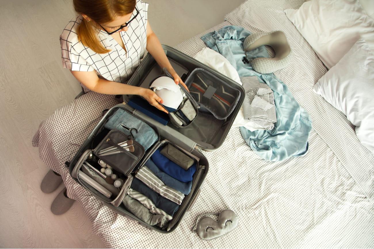 woman packing a bag for travel
