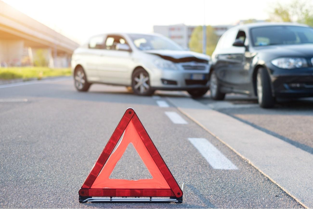 red triangle indicating car crash on the background