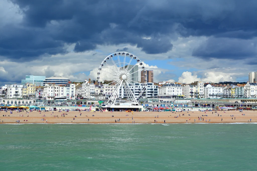 Image of Brighton Pier with the city skyline rising in the background.