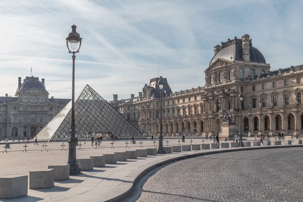 Picture shows the Louvre museum, in Paris, and its iconic glass pyramid. 