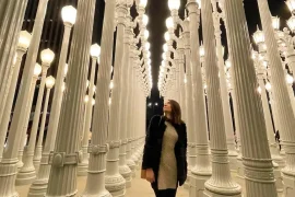 Young Woman at LACMA, posing in front of the iconic lamp posts.