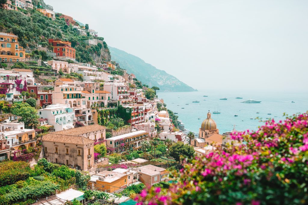 Cliffside town of Positano, Italy, with colorful buildings overlooking the Mediterranean Sea.