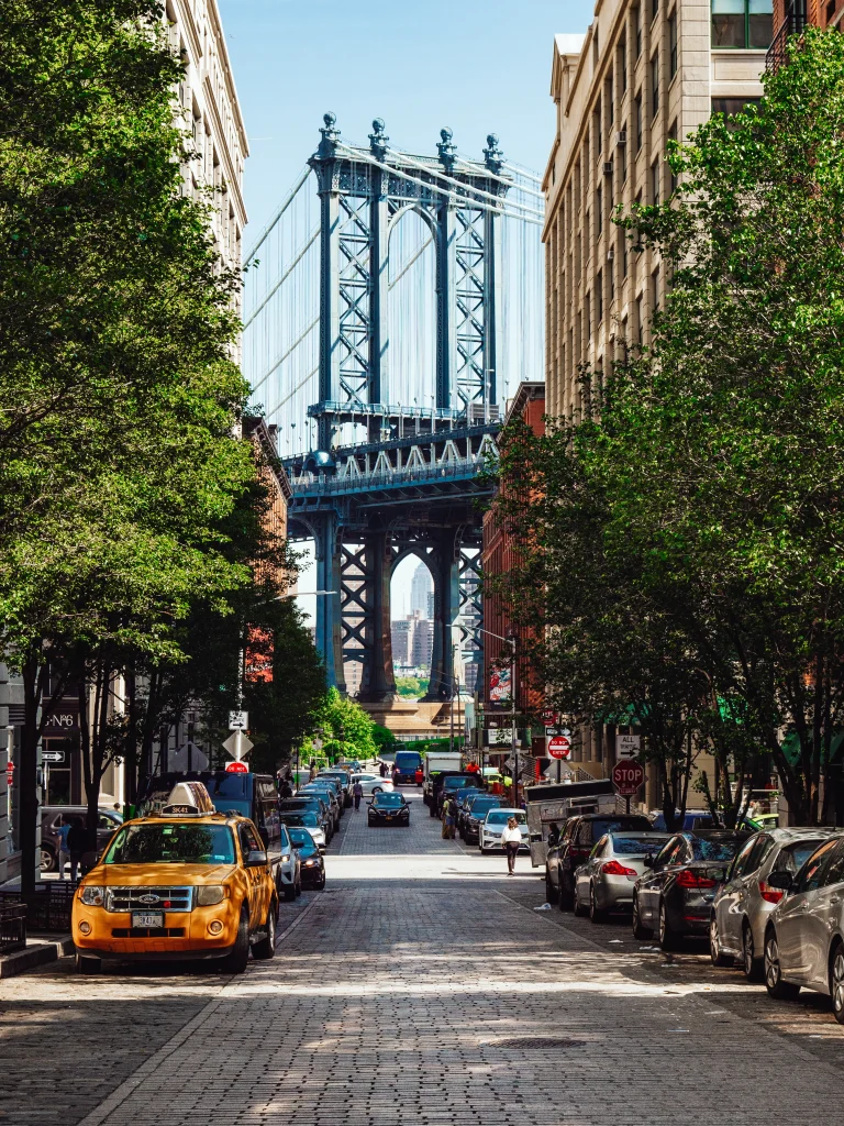 Brooklyn Bridge seen from the famous alleyway in Dumbo.